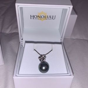 Plumeria necklace with a purple pearl